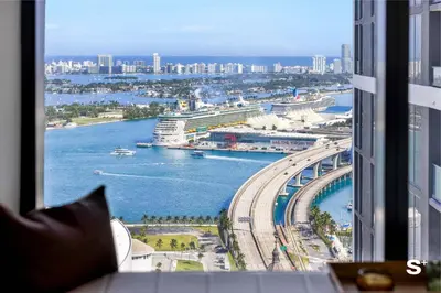 a view of a river from a window in a building at Modern DTW Miami Escape with Water Views in Miami