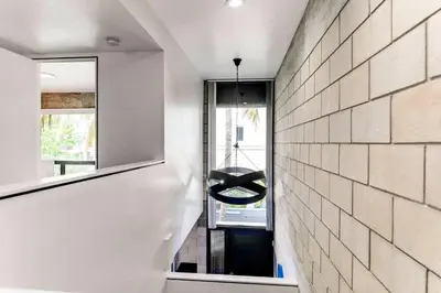 a hallway of a house with a mirror at Entire townhouse Ft Lauderdale in Fort Lauderdale