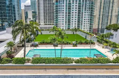 a swimming pool in a city with tall buildings at Brickell-AKA Free Parking by Palermo Home Miami in Miami