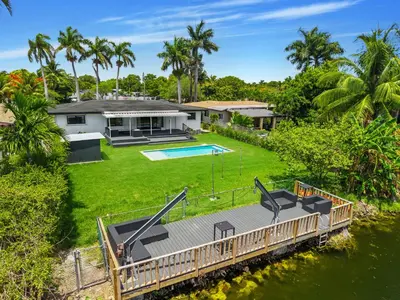 an aerial view of a house with a large yard at Luxury Miami Waterfront Retreat with Private Dock in Golden Glades