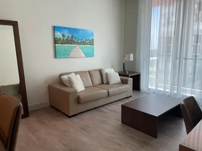 a living room with a couch and a table at Ocean Dream at Costa Hollywood in Hollywood