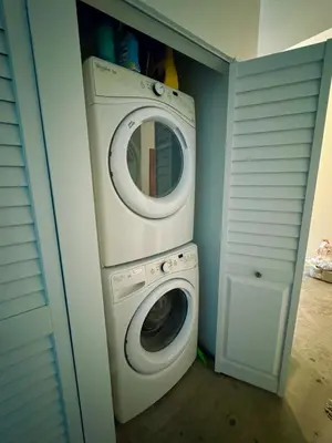 a washing machine and a washer in a closet at Elevated Elegance Luxe View Pool Free Parking in Miami