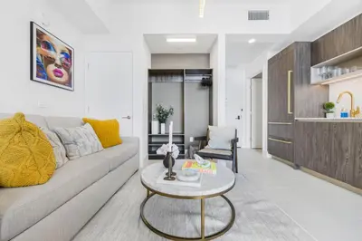 a living room with a couch and a table at Luxury Studio with Stunning City Views in Miami