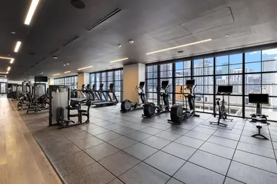 a gym with treadmills and exercise equipment in a building at Exclusive Studio with City Views in Downtown Miami in Miami