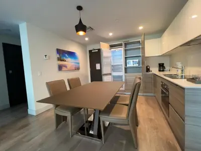 a kitchen and dining room with a table and chairs at A Fantastic apart with balcony and partial view of the beach 4 Px in Hollywood