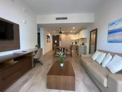 a living room with a couch and a table at A Fantastic apart with balcony and partial view of the beach 4 Px in Hollywood