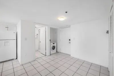 a white room with a washing machine in it at Shine Suites Balcony Duplex 9 in Miami Beach