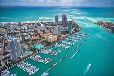 an aerial view of a city with boats in the water at 2-Min to Beach, Upscale Enclave in Miami Beach