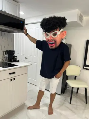 a man wearing a mask and glasses in a kitchen at AMIRI Hollywood 5 mins from Hard Rock Stadium & The Guitar in Hollywood