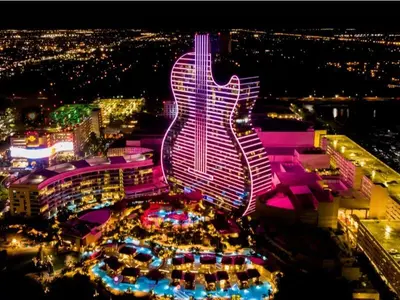 a large building with a guitar lit up at night at HavanaDolphinsluxury 2PPL TopLocation Parking Pets in Hollywood Ridge Farms