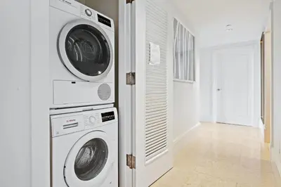 a laundry room with a washer and dryer at Ritz-Carlton Luxury Oceanfront 2BR on 16th Floor in Fort Lauderdale