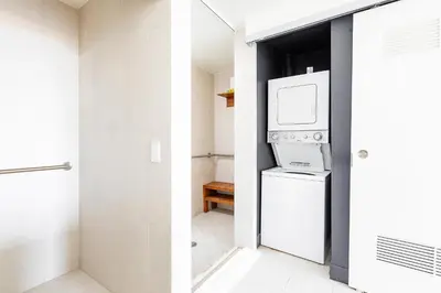 a kitchen with a refrigerator and a microwave at W Residences 2 Bed Unit - Beachfront and Luxe Stay in Fort Lauderdale