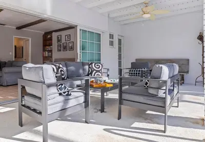 a living room with two chairs and a table at Tranquil Heirloom Hideaway Pool in South Miami in Miami