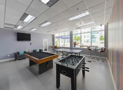 an office with two ping pong tables in a room at Relax and stunning view 20th Floor Views in Miami
