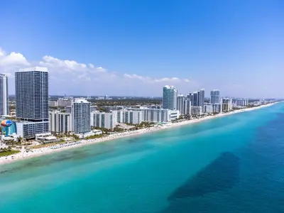 an aerial view of a beach in front of a city at Lyfe Resort 2307 in Hollywood