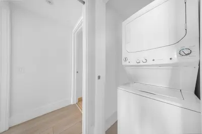 a white washer and dryer in a white room at High-End Apartment in a Luxury Resort with Gorgeous Amenities in Hollywood