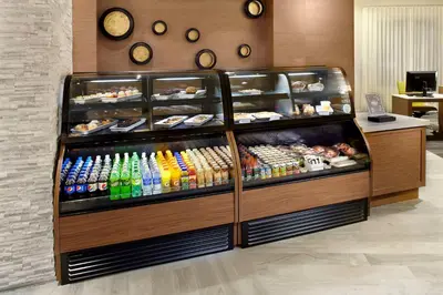 a display case filled with different types of food at Hyatt Place Miami Airport East in Miami