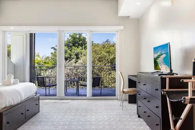 a bedroom with a bed and a desk at Exclusive Doral Villa with Luxury Amenities in Miami