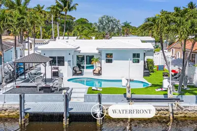 a house on the water with a marina at Waterfront Bungalow Heated Pool Pineapple Key in Fort Lauderdale