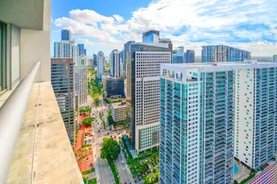 an aerial view of a city with tall buildings at Panoramic City Views From 45th Floor Brickell Condo in Miami