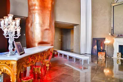 a room with a bench and a large statue at Panoramic City Views From 45th Floor Brickell Condo in Miami