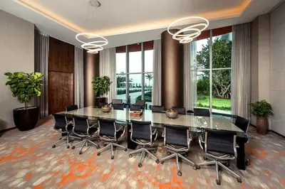 a conference room with a large glass table and chairs at Live The Perfect Vacations in a Condo From The High in Hollywood