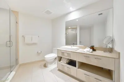 a white bathroom with a sink and a toilet at Live The Perfect Vacations in a Condo From The High in Hollywood