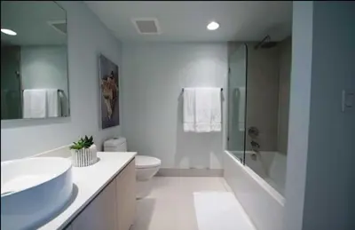 a bathroom with a sink and a toilet and a shower at Trendy Miami Apartment Walk to the Beach in Hallandale Beach