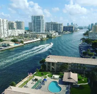 a view of a river in a city with buildings at Trendy Miami Apartment Walk to the Beach in Hallandale Beach