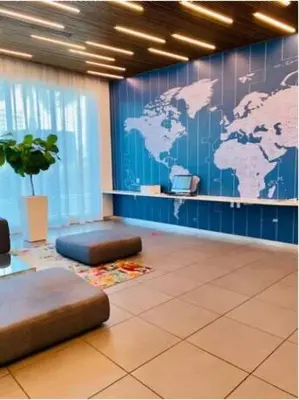 a room with a map of the world on the wall at Studio Beach Apmt 2 Full Q Beds, Amazing View in Hallandale Beach