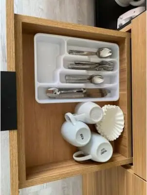 a drawer with utensils in a wooden cabinet at Studio Beach Apmt 2 Full Q Beds, Amazing View in Hallandale Beach