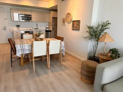 a kitchen and dining room with a table and chairs at 1BR 1BA with Pool & Sun in Miami Beach in Hallandale Beach