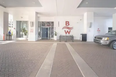 a car parked in front of a building at 2B 2B Beachfront Pool Gym and Restaurant in Hallandale Beach