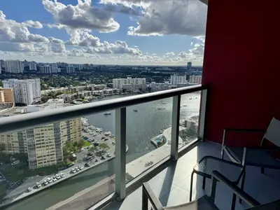 a balcony with a view of a city and a river at Getaway in Miami 2B 2B beachfront near Aventura 3003 in Hallandale Beach