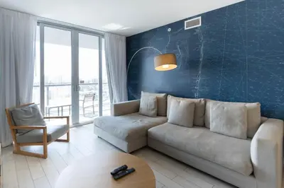 a living room with a couch and a table at 2B 2B Beautiful Apt in Hallandale Beach with Beach Service 2605 in Hallandale Beach