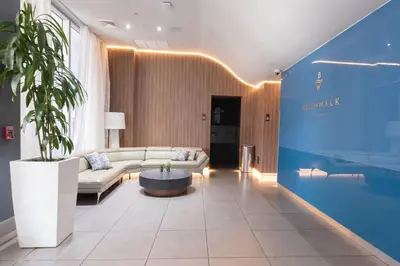 a living room with a couch and a table at Miami Apt with Gym Beach Service Pool on the water 2607 in Hallandale Beach