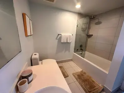a bathroom with a toilet and a bath tub at Beach Apt with Full kitchen and King size bed in Hallandale Beach