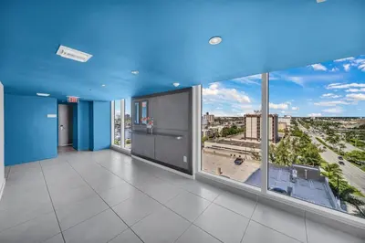 a large room with blue ceilings and large windows at Charming 2 Bedroom Apt with Pool & Beach Service 2808 in Hallandale Beach