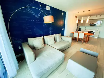 a living room with a couch and a table at 2610 Enjoy Miami 2B 2B, Pool, Beach & Mall in Hallandale Beach