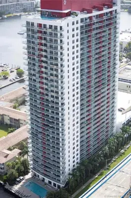 an aerial view of a tall building with a pool at Suite with Beach Serv Pool and close to Aventura Mall 2808 in Hallandale Beach