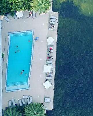 an overhead view of a swimming pool next to a lake at Beachfront Studio, 2 Full Beds, Dream View 2804 in Hallandale Beach