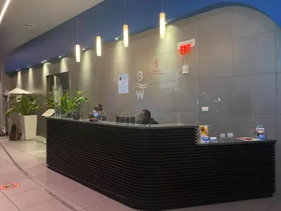 a counter in a restaurant with a person sitting at it at Beachfront Studio, 2 Full Beds, Dream View 2804 in Hallandale Beach