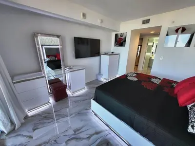 a bedroom with a bed and a television in it at 2b 2b Apmt Hallandale Beach 2805 in Hallandale Beach
