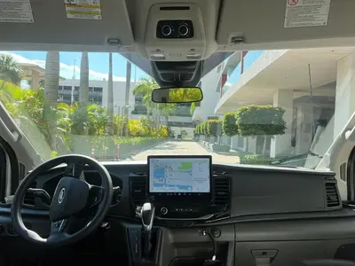 a view from the inside of a bus with a laptop on the dashboard at Miami Beach Cozy 1B with Pool and Beach Service 1506 in Hallandale Beach
