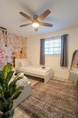 a living room with a couch and a ceiling fan at Renovated Sept 2024! Pool - Mini Golf - Volleyball in Joe Robbie Stadium Heliport