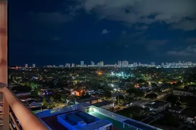 a view of the city at night at Hollywood Beach Speakeasy Condo in Hollywood