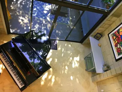 an overhead view of a living room with a glass ceiling at Piano House on the Water in Fort Lauderdale