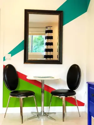 two chairs and a table in front of a mirror at Studio in Las Olas near FL Beach in Fort Lauderdale
