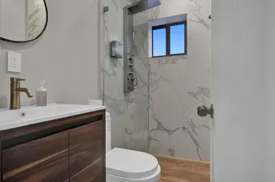 a bathroom with a shower with a toilet and a sink at Miami Flats - Self Check-in and 1 Free Parking in Miami