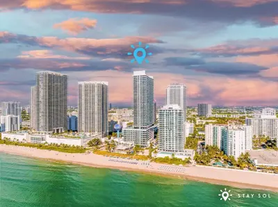 a view of a city with a beach and buildings at Stylish Apt - Beach View - Resort Access in Hollywood